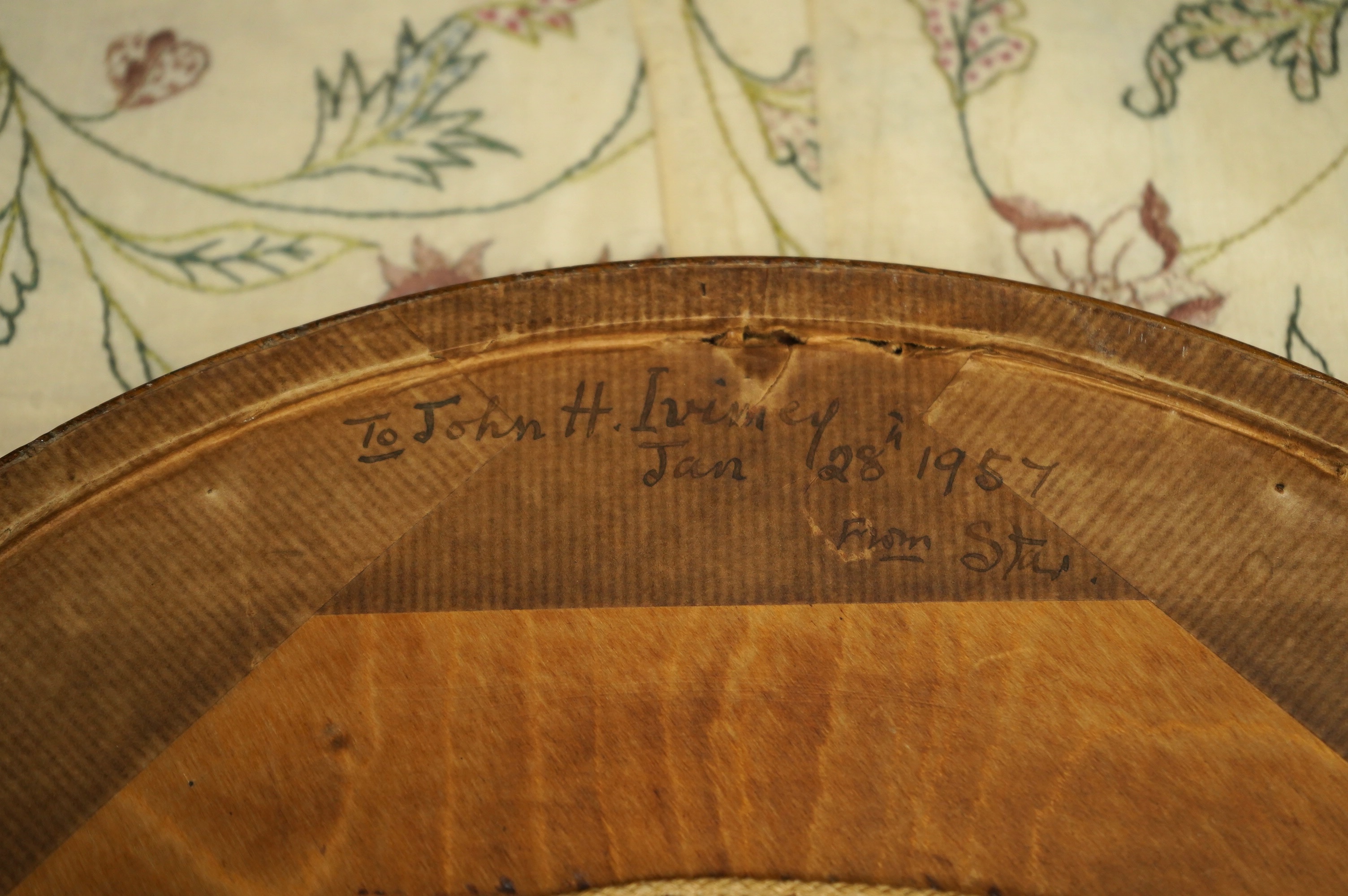 A framed, 19th century, possibly Scandinavian, red felt circular multi-coloured silk embroidery of flowers, acorns and leaves, also embroidered with fine stump work style beadwork flower detail, 32cm diameter. Condition